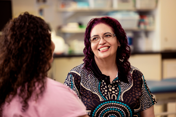 Health professional chatting with patient