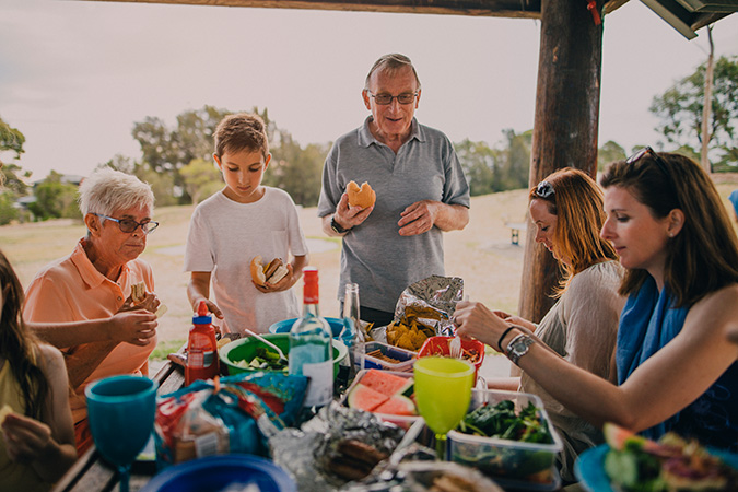 Family sitting at table eating lunch