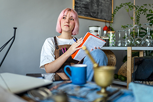 Teenager with study notebooks