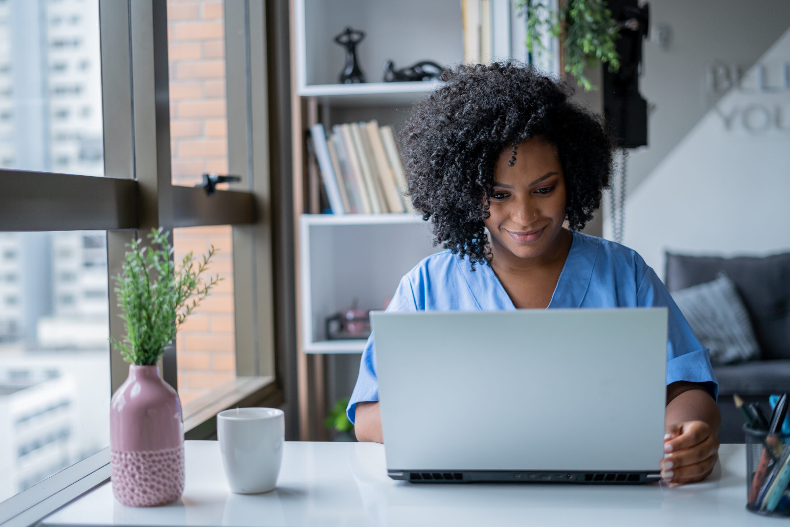 Woman using laptop computer at home