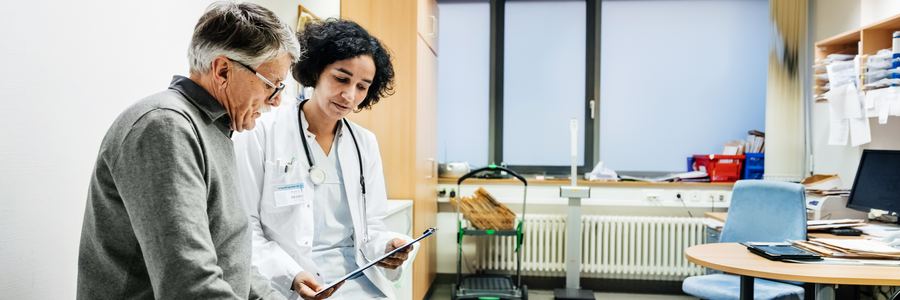 man speaking with health professional