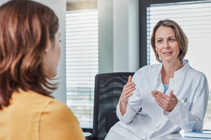 Health professional talking with patient