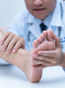 Health professional examining patients feet
