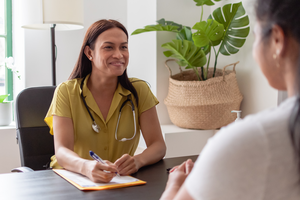 Health professional chatting to client in appointment