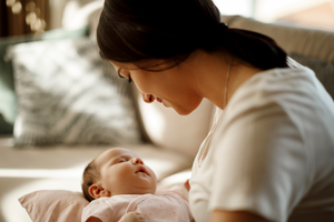 Mother looking down at baby