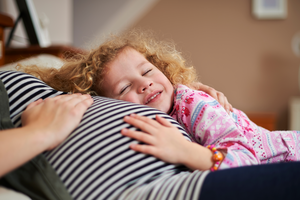 Child hugging pregnancy bump