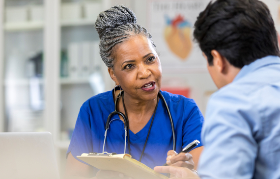 Health professional talking with patient