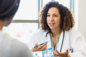 Health professional discussing brochure with patient