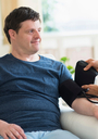 Man with down syndrome having blood pressure measured