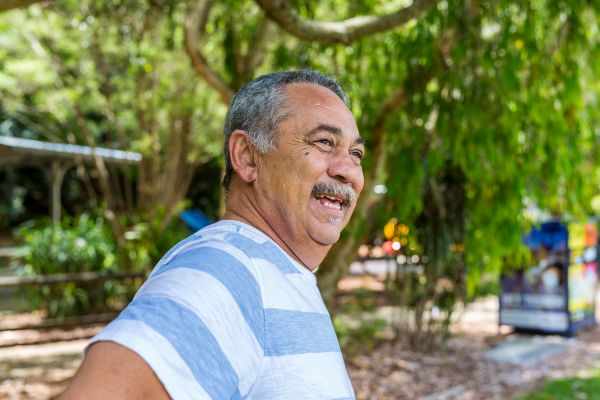 Middle aged man, standing in a park