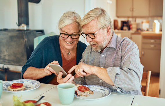 Older couple using a mobile