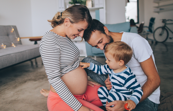 little boy being curious about his mother's growing belly