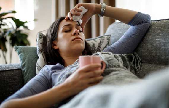 Sick woman lying on lounge