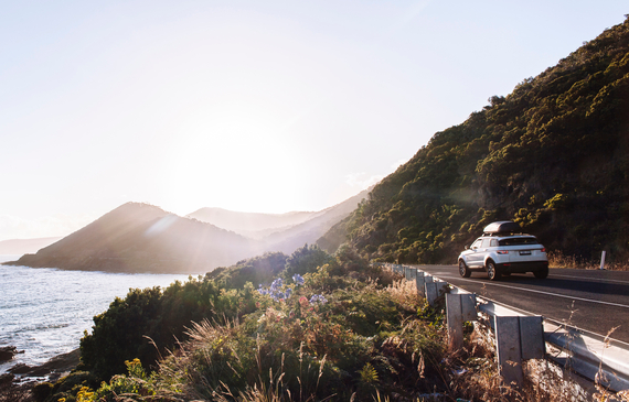 Car driving on coastal road