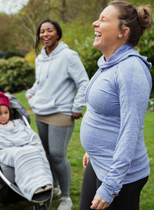 Group of women in park with child in stroller