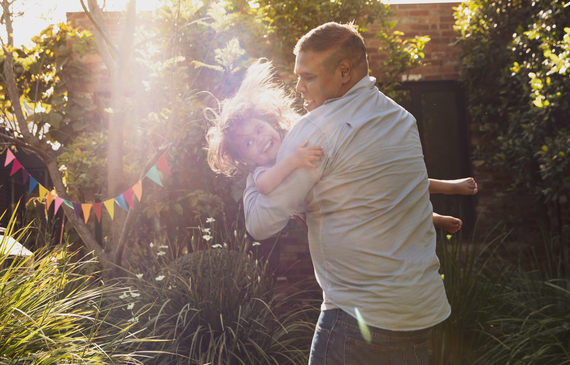 Father spinning his child around