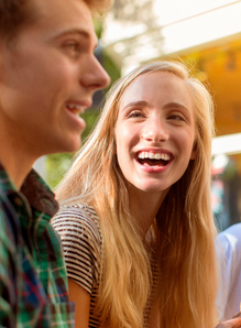 Young women laughing with boyfriend