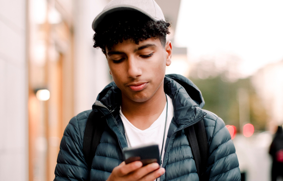 Teenage using mobile phone