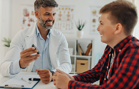 Health professional treating a young person 